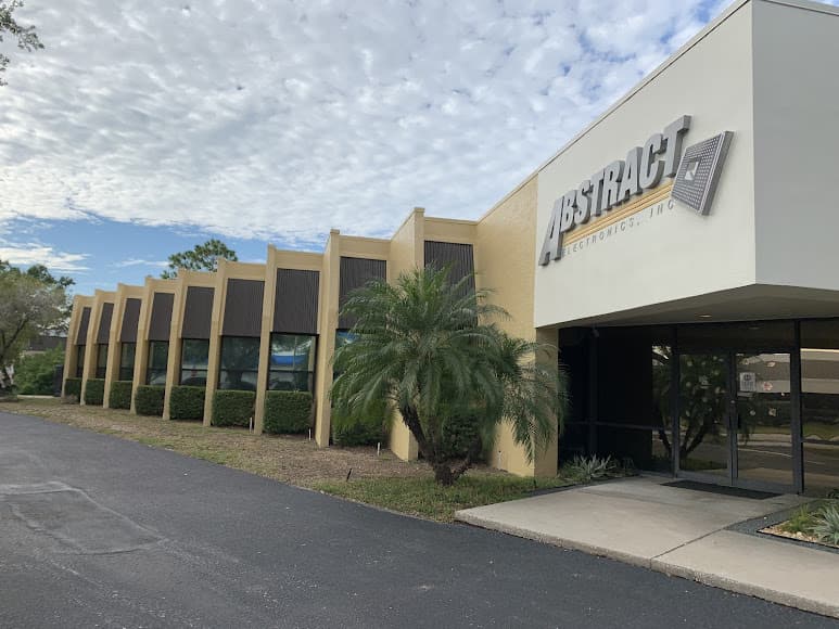 Commercial building with company signage and finished exterior paint.